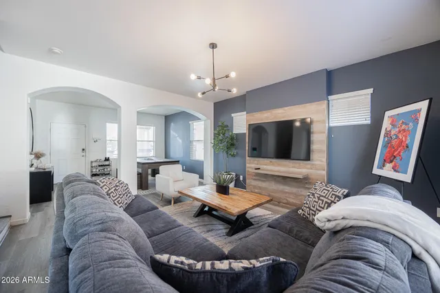 a living room with furniture and a flat screen tv