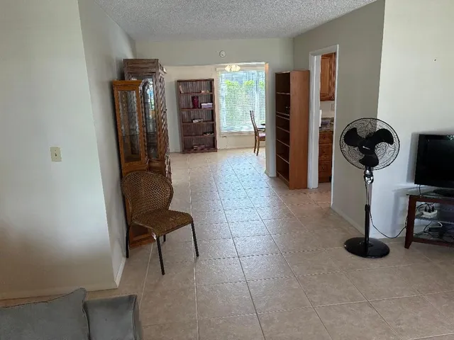 a view of a entryway with furniture and closet