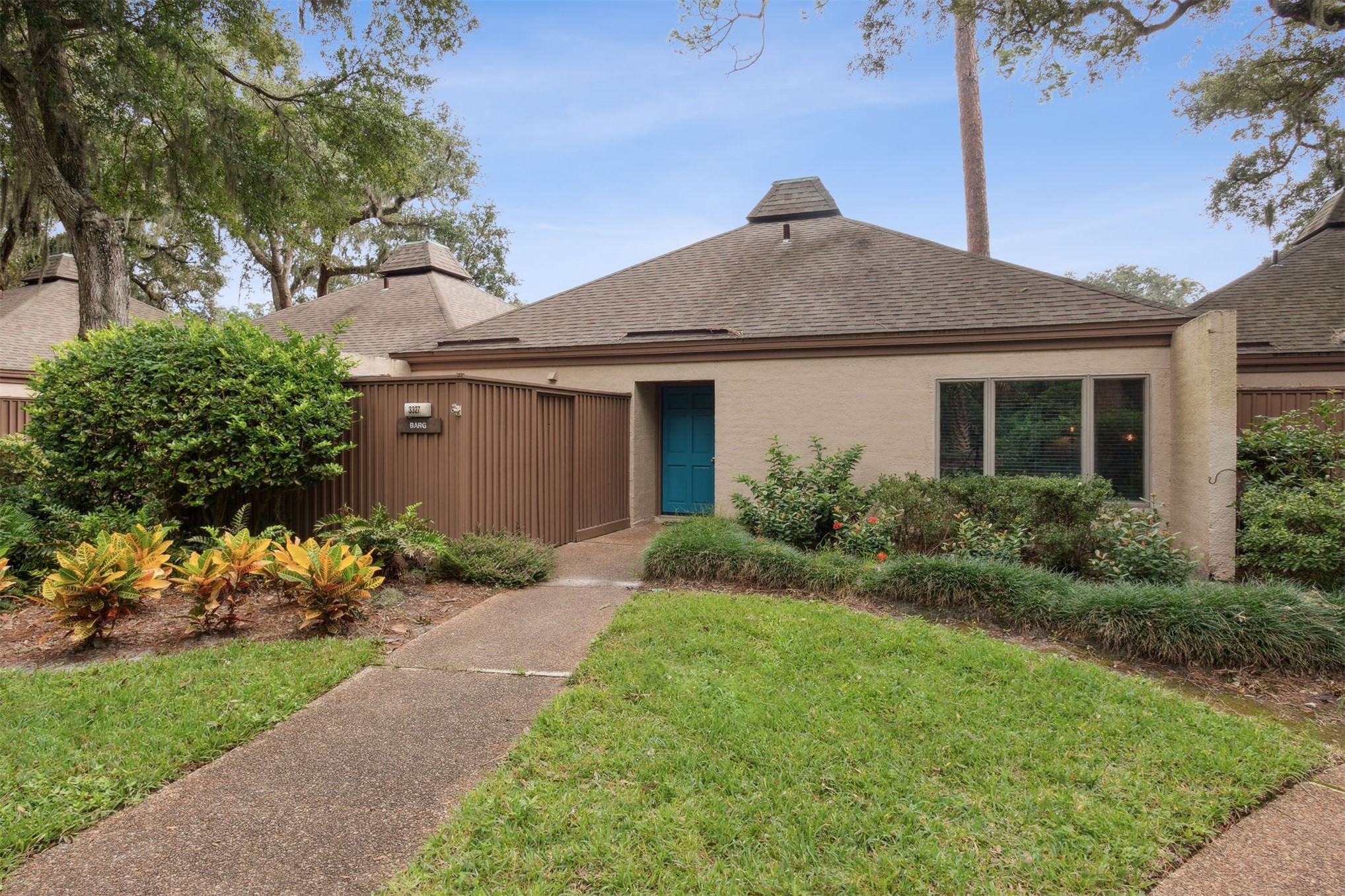 3327 Sea Marsh Road, Unit 3327 Fernandina Beach, FL 32034 - Photo 1 of 39 a front view of house with a garden