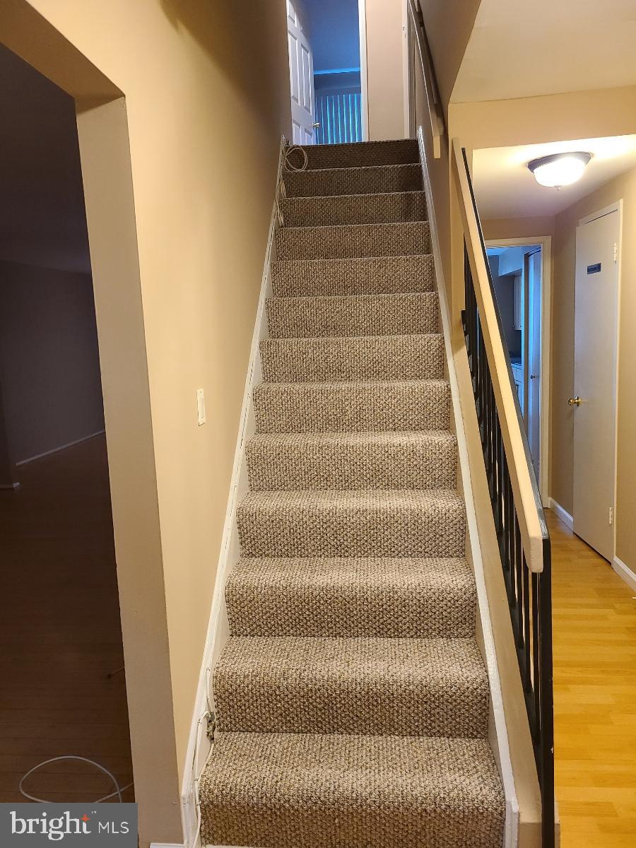 10410 Faulkner Ridge Circle, Unit 36 Columbia, MD 21044 - Photo 13 of 23 Staircase with new berber carpet