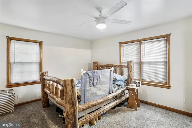 a bed room with a bed and a window