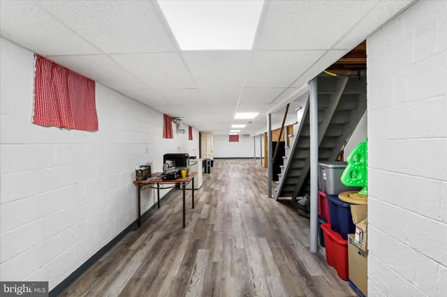 a room with wooden floor and furniture