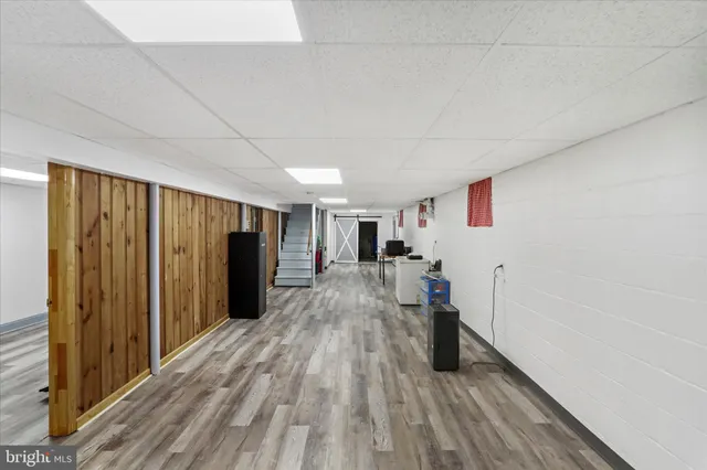 a view of a garage with rack and bicycle