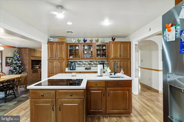 a kitchen with a sink appliances and cabinets