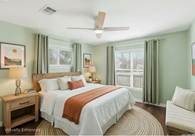 a bedroom with a large bed and a window