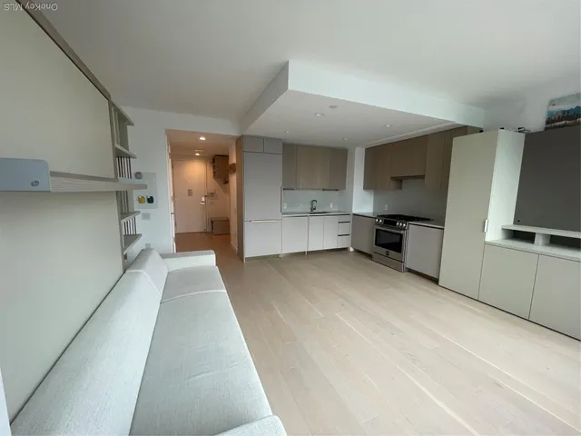 a view of a kitchen with electric appliances