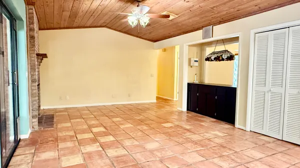 a view of an empty room with a fireplace