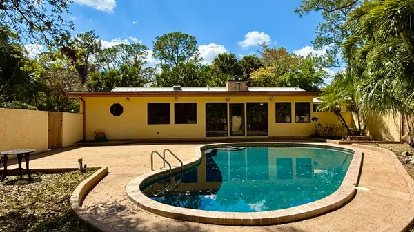 a view of a house with swimming pool