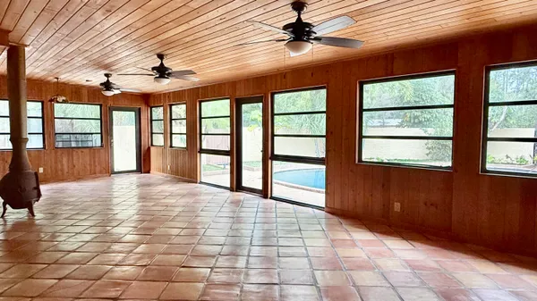 a view of an entryway with a floor to ceiling window
