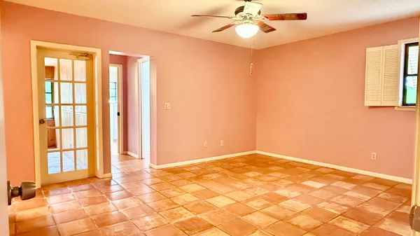 a view of a room with a air conditioner and a window