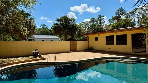 a view of swimming pool having outdoor seating