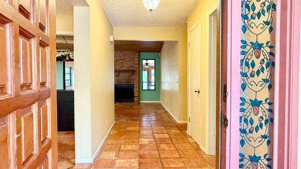 a view of a entryway door with wooden floor
