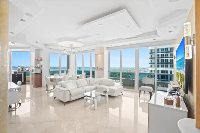 a kitchen with a refrigerator a stove top oven a sink and dishwasher with wooden floor