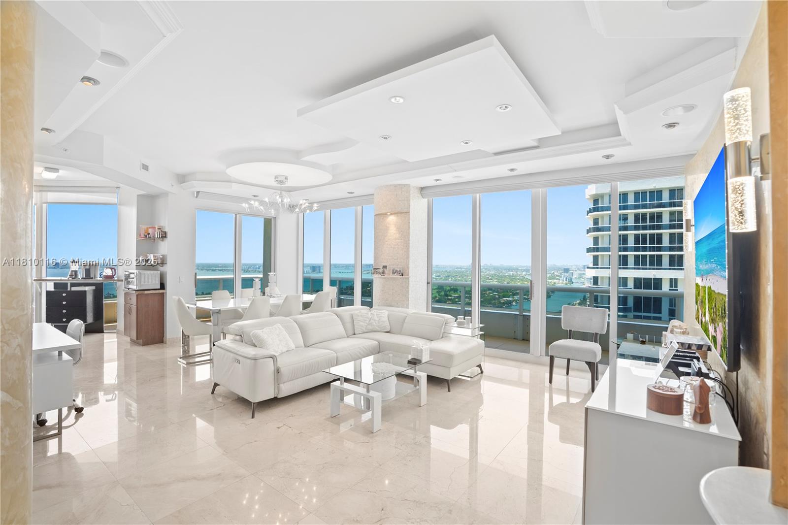 4775 Collins Avenue, Unit PH4107 Miami Beach, FL 33140 - Photo 12 of 62 a living room with furniture large windows and view of living room