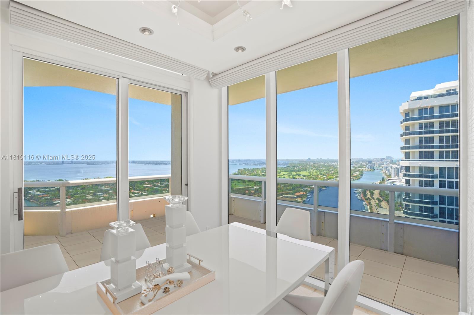 4775 Collins Avenue, Unit PH4107 Miami Beach, FL 33140 - Photo 14 of 62 a view of a living room with a floor to ceiling window and an empty room