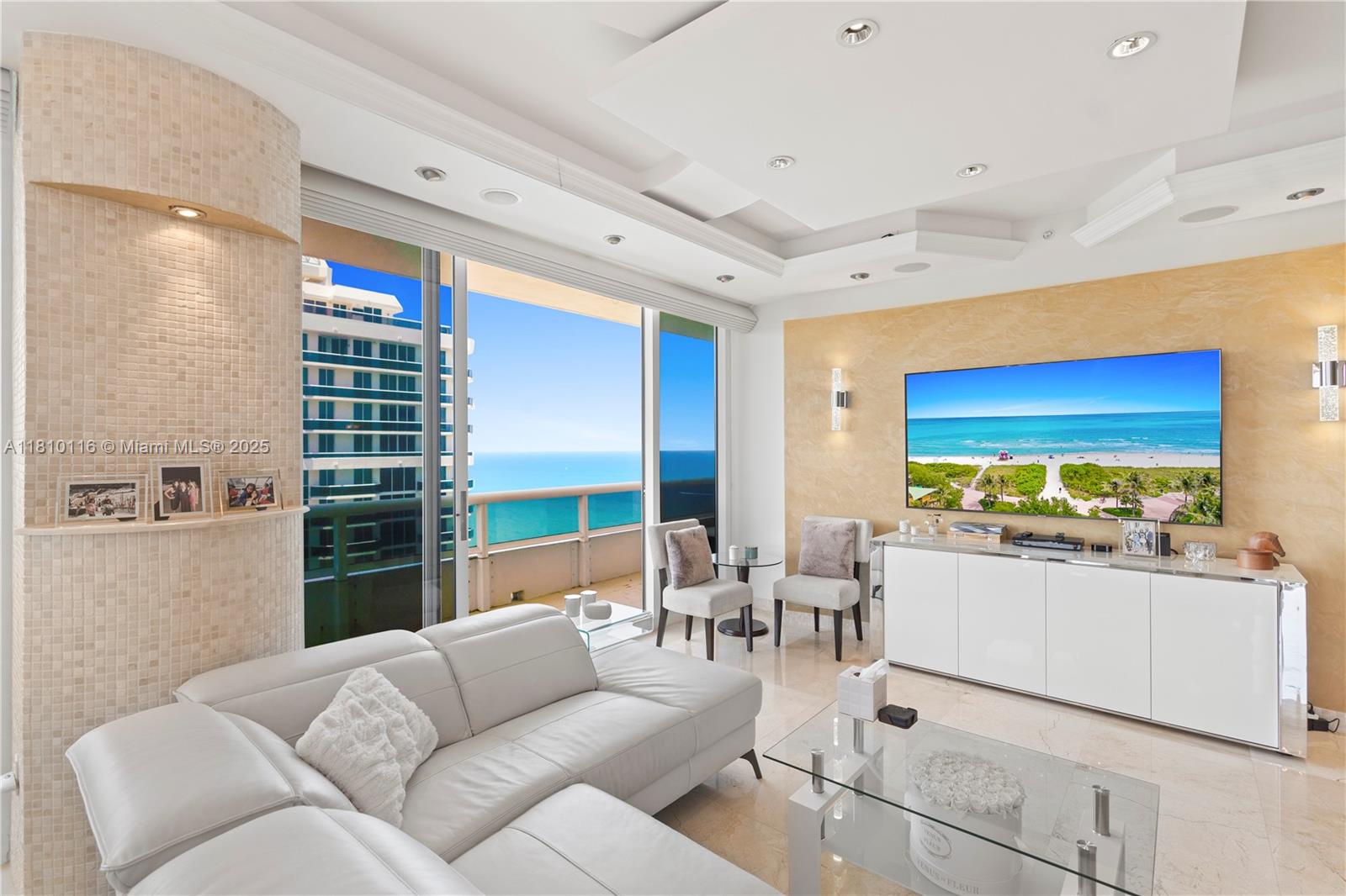 4775 Collins Avenue, Unit PH4107 Miami Beach, FL 33140 - Photo 16 of 62 a living room with furniture and a large window