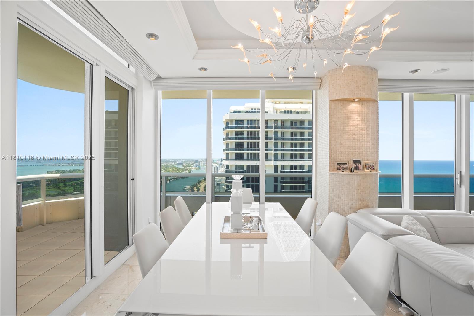 4775 Collins Avenue, Unit PH4107 Miami Beach, FL 33140 - Photo 17 of 62 a spacious bedroom with a large bed and a large window