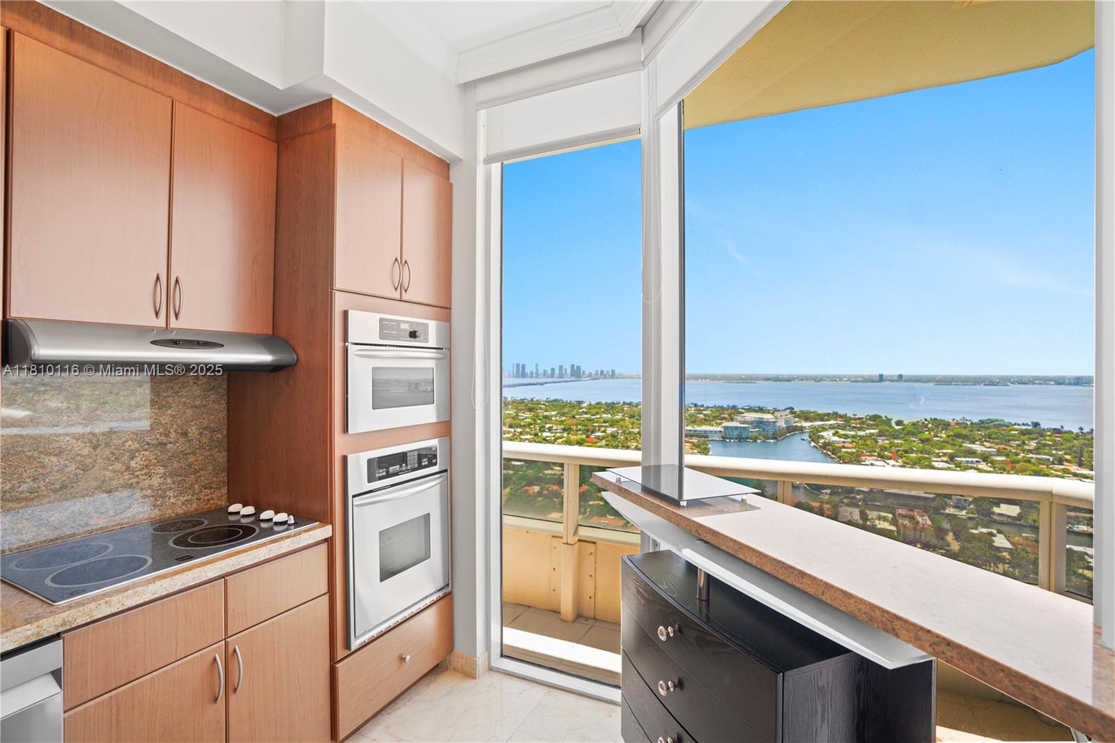 4775 Collins Avenue, Unit PH4107 Miami Beach, FL 33140 - Photo 22 of 62 a view of a kitchen with a sink and dishwasher