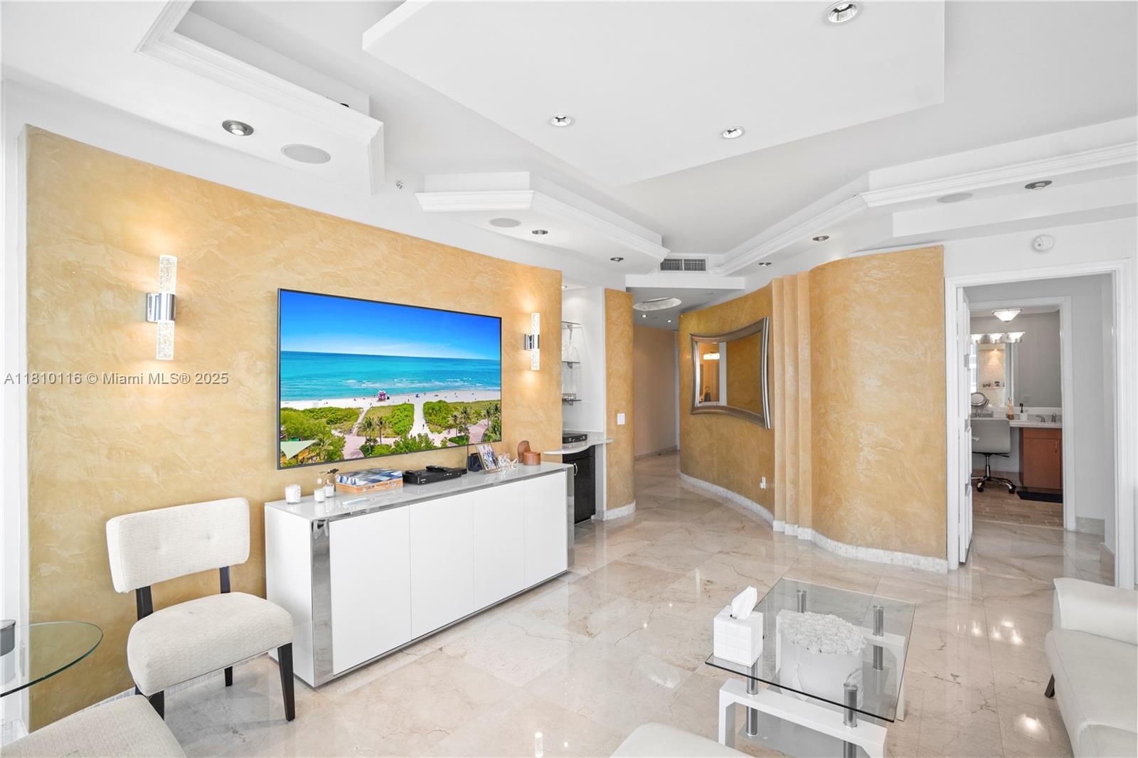 4775 Collins Avenue, Unit PH4107 Miami Beach, FL 33140 - Photo 26 of 62 a living room with furniture kitchen view and a large window