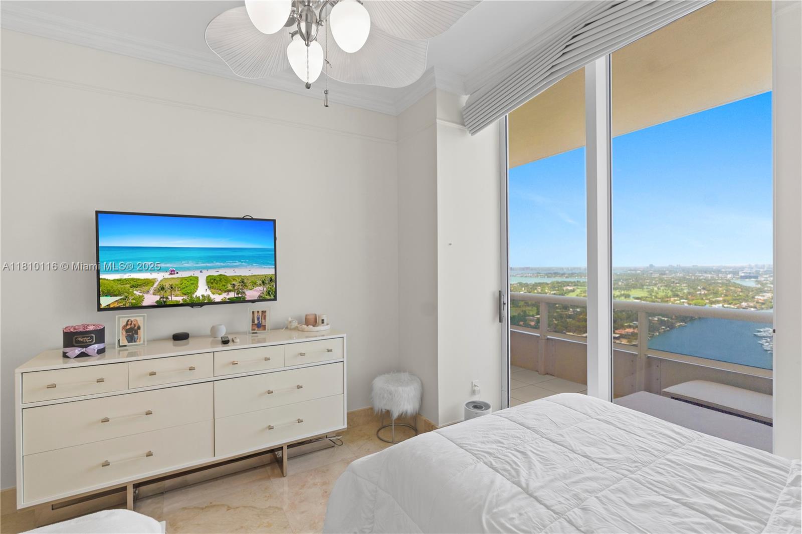 4775 Collins Avenue, Unit PH4107 Miami Beach, FL 33140 - Photo 38 of 62 a bedroom with two beds and large mirror