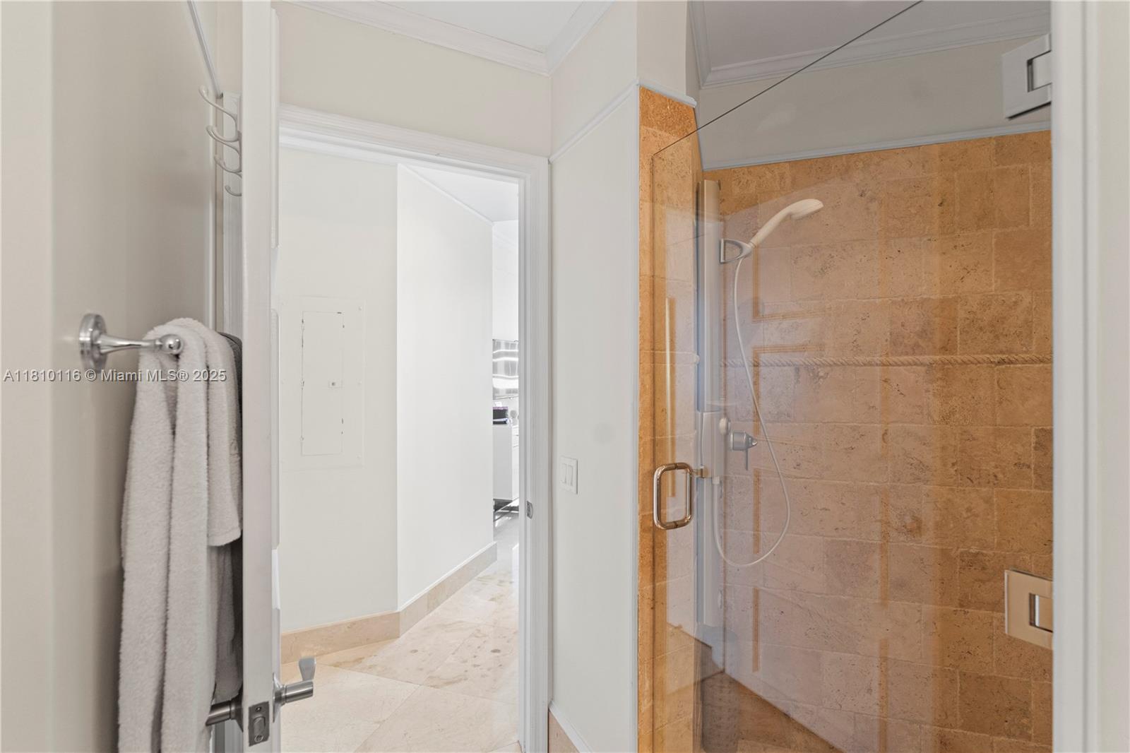 4775 Collins Avenue, Unit PH4107 Miami Beach, FL 33140 - Photo 42 of 62 a bathroom with a shower and a glass door