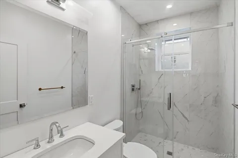 a utility room with granite countertop cabinets washer and dryer
