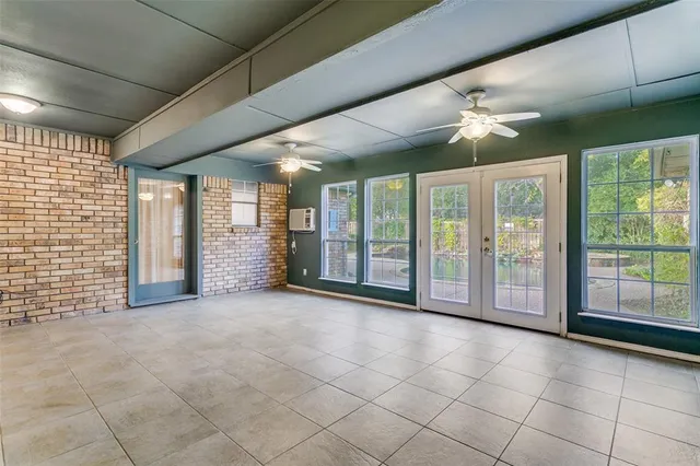a view of an empty room with a sliding door