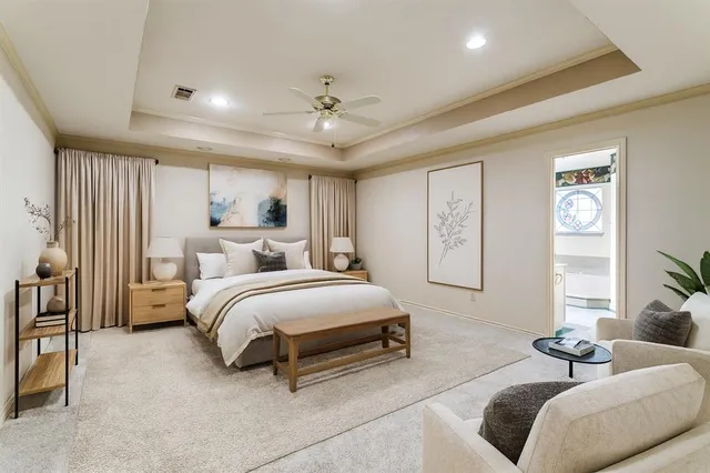 a spacious bedroom with a bed and a couch