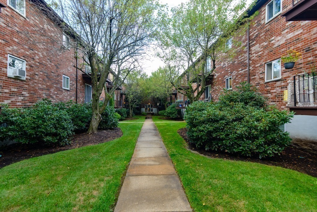 20 Westgate Road, Unit 4 Chestnut Hill, MA 02467 - Photo 1 of 16 a view of a pathway with a pathway