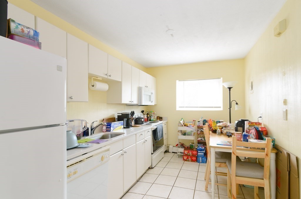 20 Westgate Road, Unit 4 Chestnut Hill, MA 02467 - Photo 2 of 16 a kitchen with a sink and cabinets