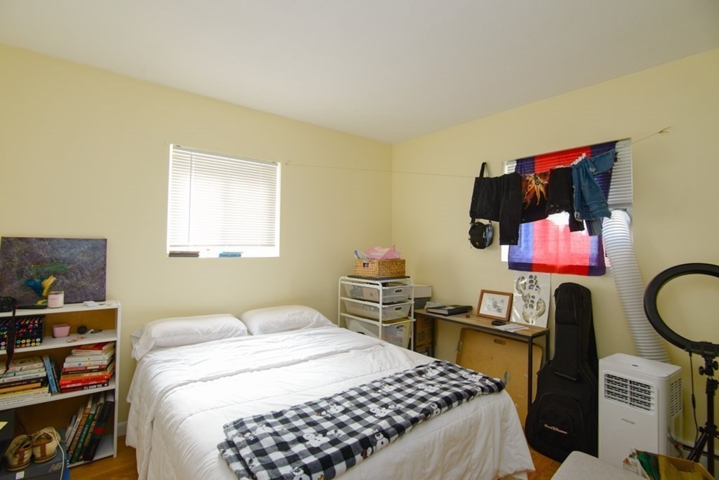20 Westgate Road, Unit 4 Chestnut Hill, MA 02467 - Photo 5 of 16 a bedroom with a bed and dresser