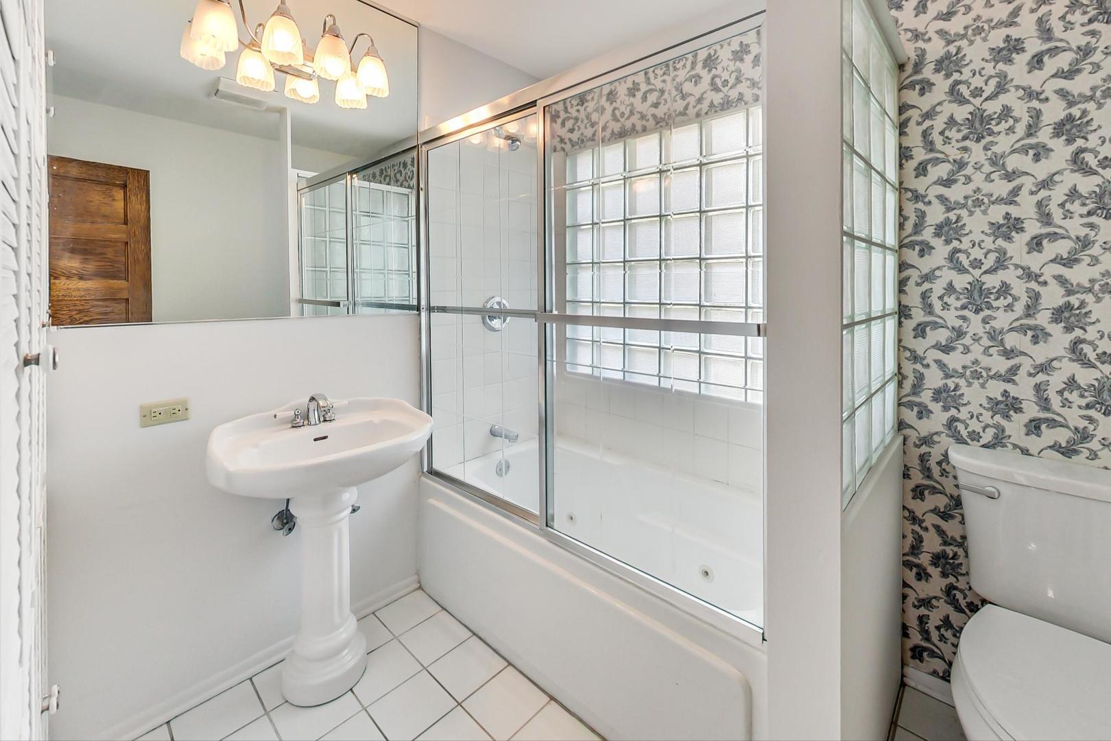 37 7th Avenue La Grange, IL 60525 - Photo 11 of 45 a bathroom with a sink toilet and shower