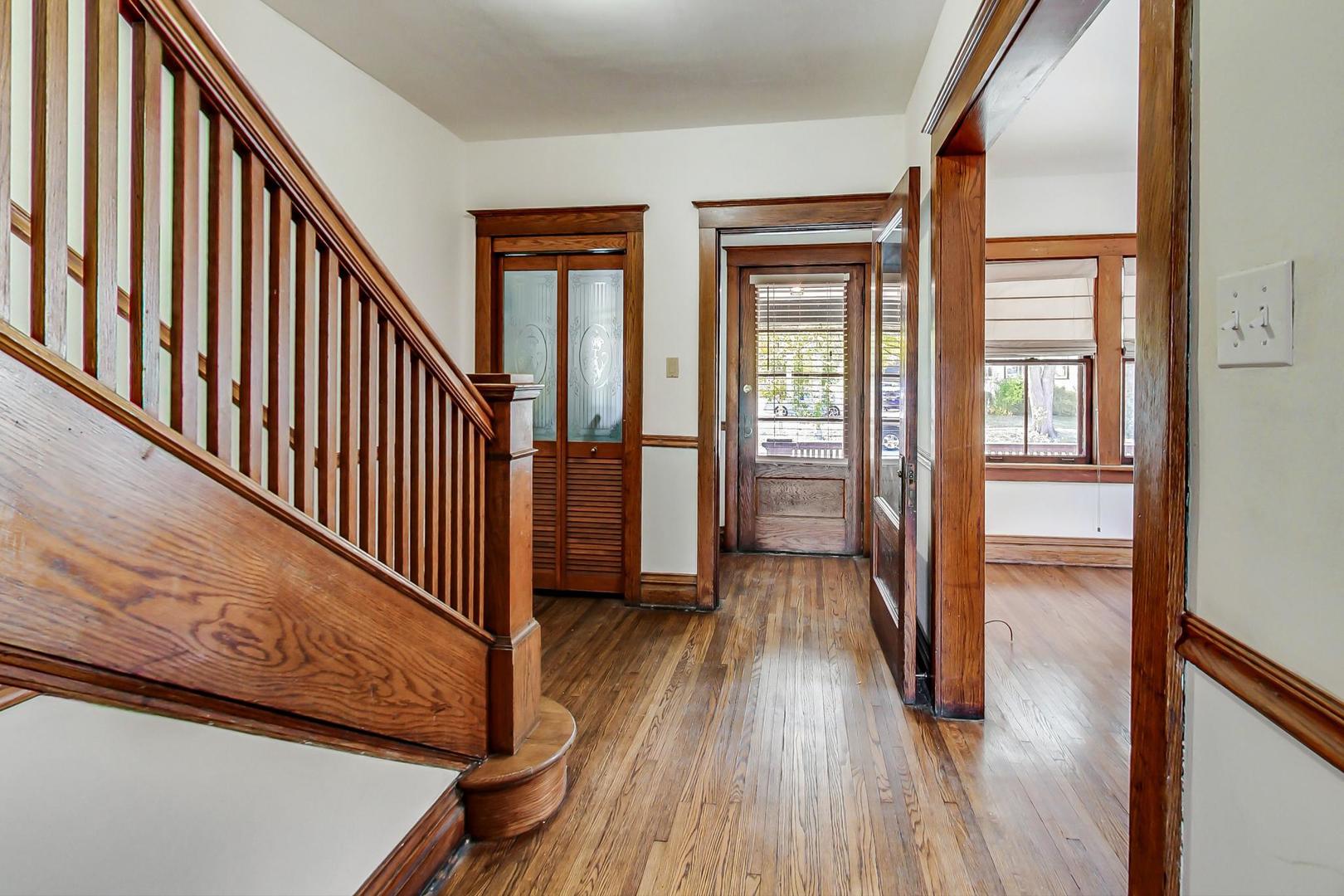 37 7th Avenue La Grange, IL 60525 - Photo 21 of 45 a view of a hallway with wooden floor and staircase