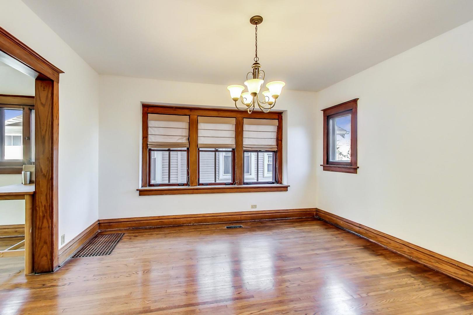 37 7th Avenue La Grange, IL 60525 - Photo 25 of 45 a view of an empty room with wooden floor and a window