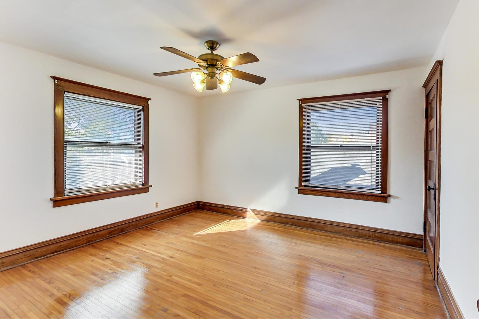 37 7th Avenue La Grange, IL 60525 - Photo 29 of 45 a view of an empty room with wooden floor and a window
