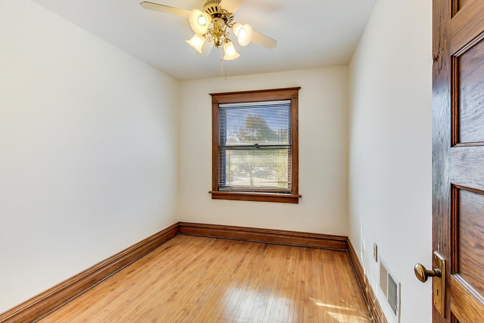 37 7th Avenue La Grange, IL 60525 - Photo 30 of 45 a view of an empty room with wooden floor and a window