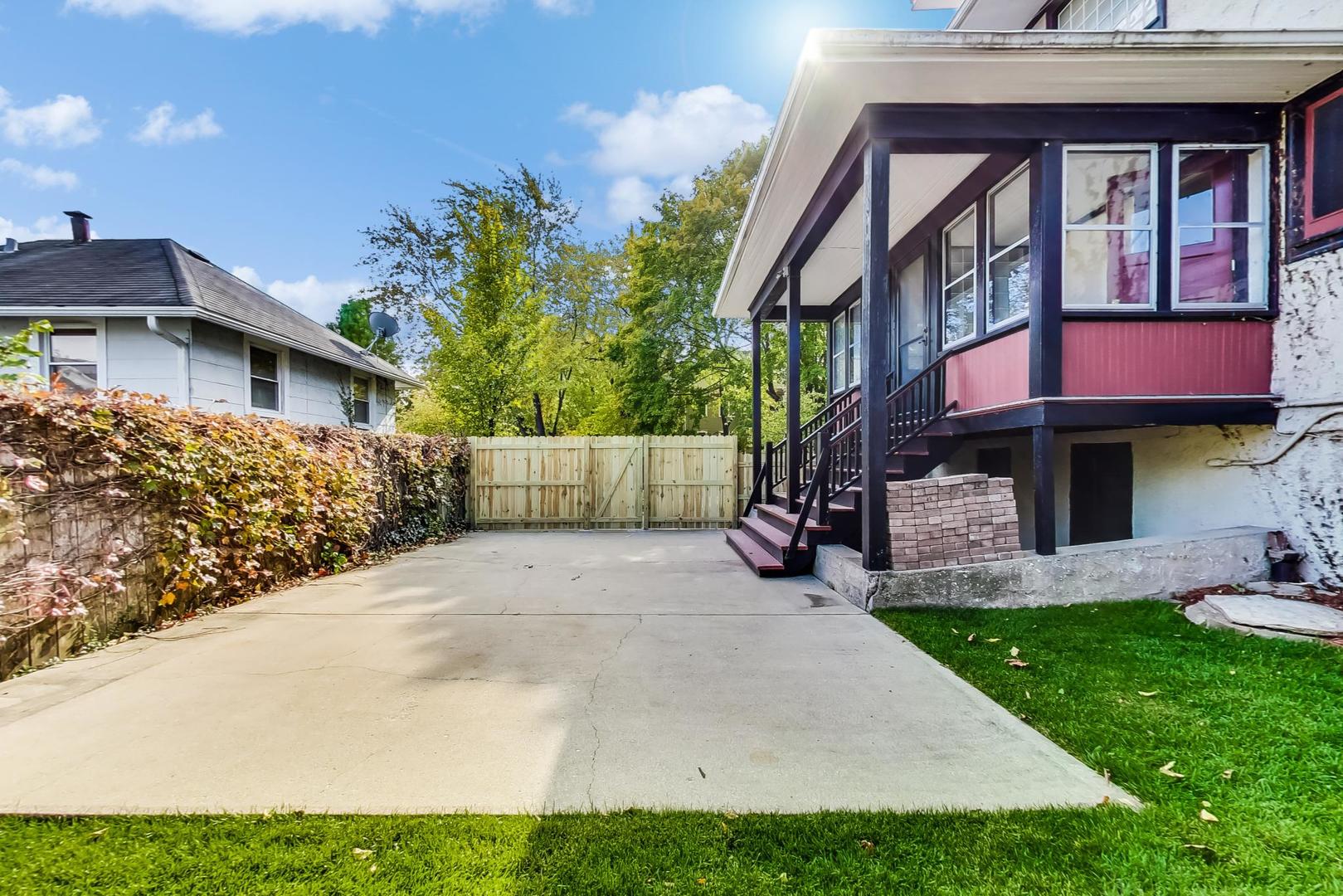 37 7th Avenue La Grange, IL 60525 - Photo 36 of 45 a view of a brick house with a yard and plants