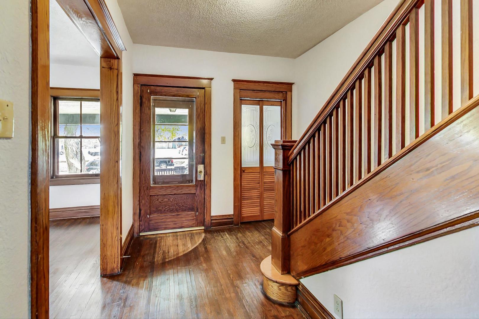 37 7th Avenue La Grange, IL 60525 - Photo 4 of 45 a view of an entryway with wooden floor and door
