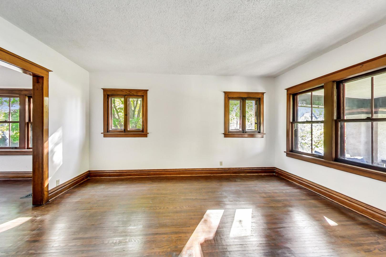 37 7th Avenue La Grange, IL 60525 - Photo 6 of 45 a view of empty room with wooden floor and fan