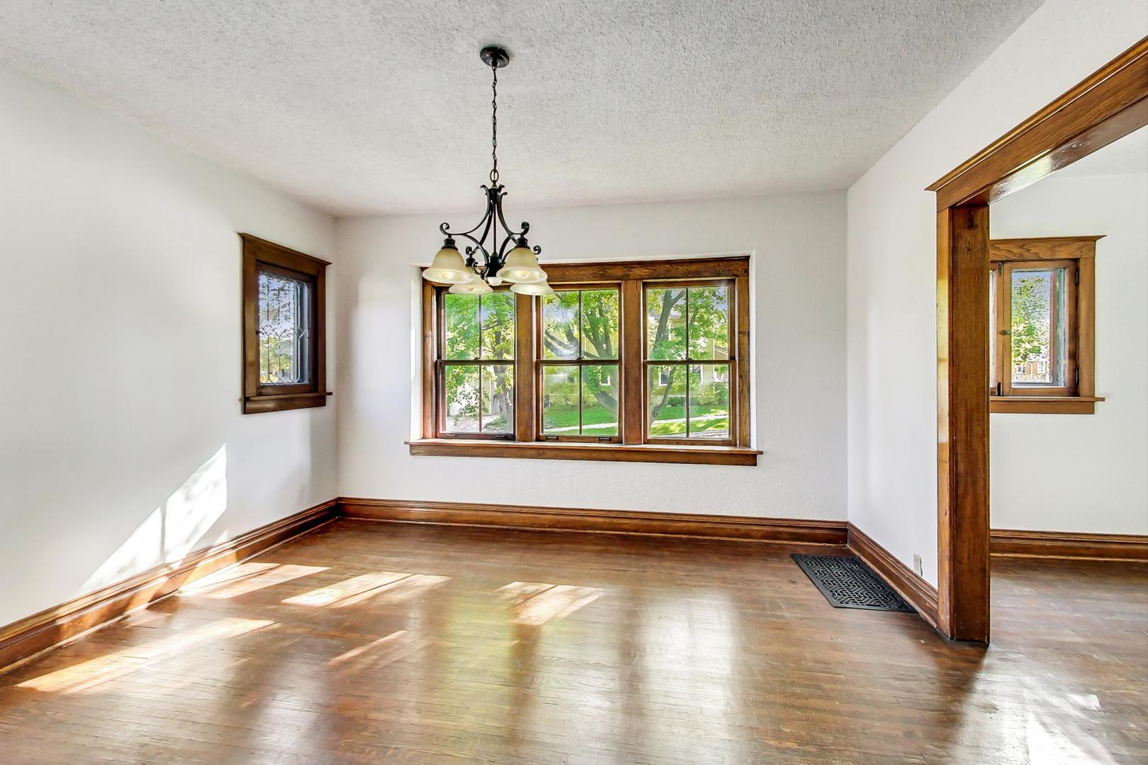 37 7th Avenue La Grange, IL 60525 - Photo 8 of 45 a view of an empty room with window and wooden floor