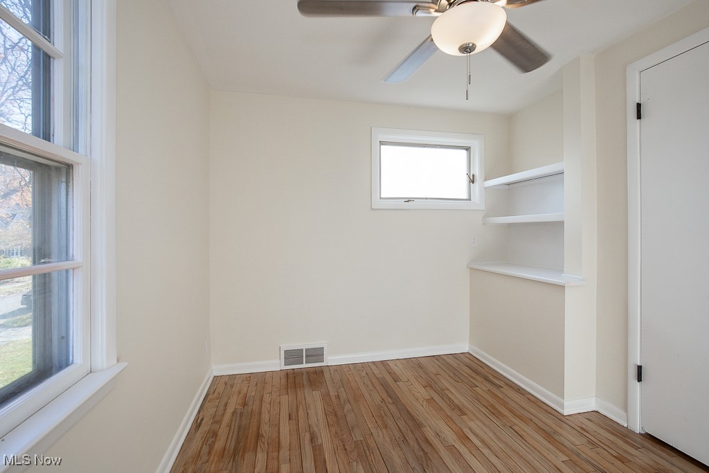 3136 Becket Road Cleveland, OH 44120 - Photo 21 of 39 Unfurnished room featuring ceiling fan and light wood-type flooring