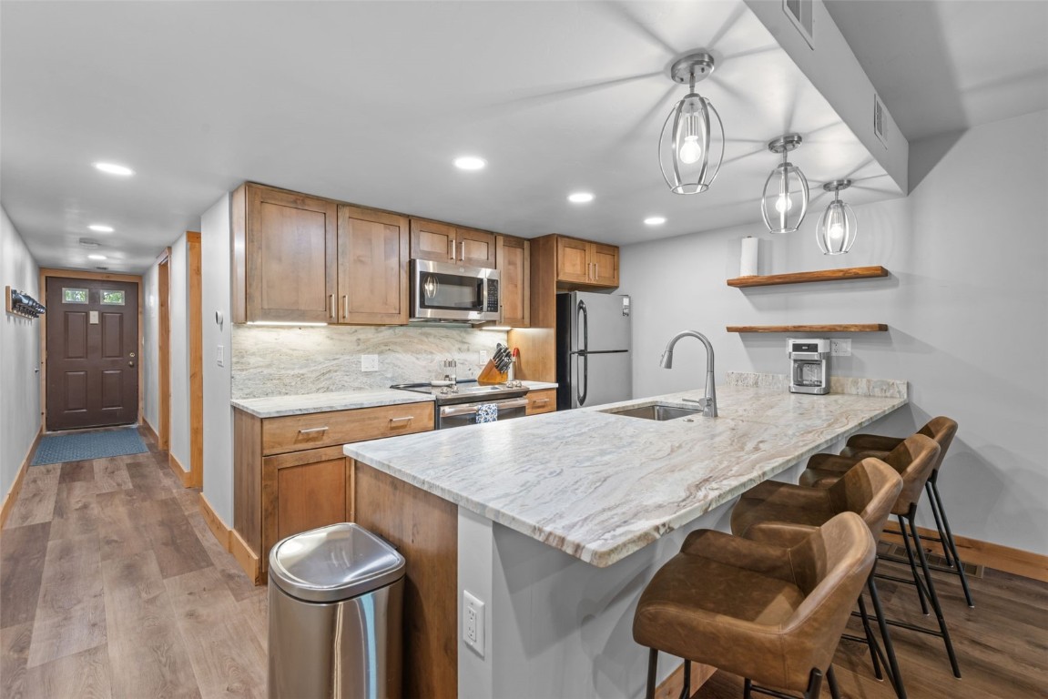 500 Bills Ranch Road, Unit 161 Frisco, CO 80443 - Photo 1 of 38 a kitchen with cabinets a sink and appliances