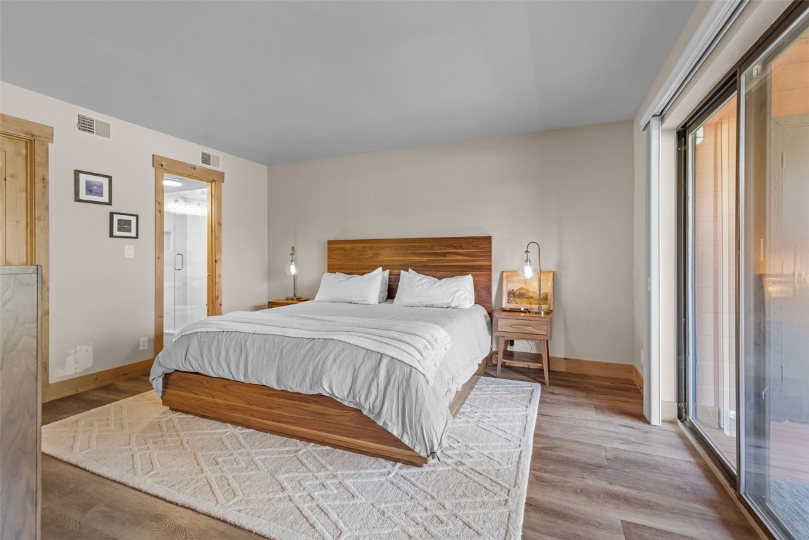 500 Bills Ranch Road, Unit 161 Frisco, CO 80443 - Photo 16 of 38 a bedroom with a bed and wooden floor
