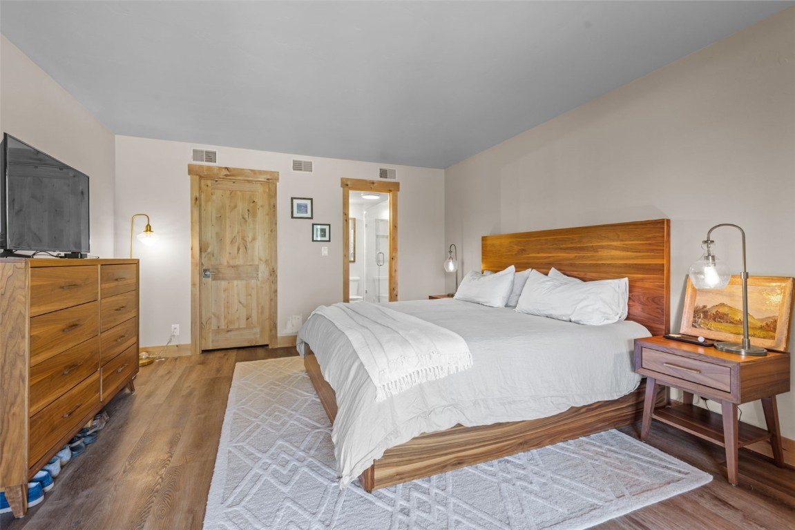 500 Bills Ranch Road, Unit 161 Frisco, CO 80443 - Photo 17 of 38 a bedroom with a bed and wooden floor