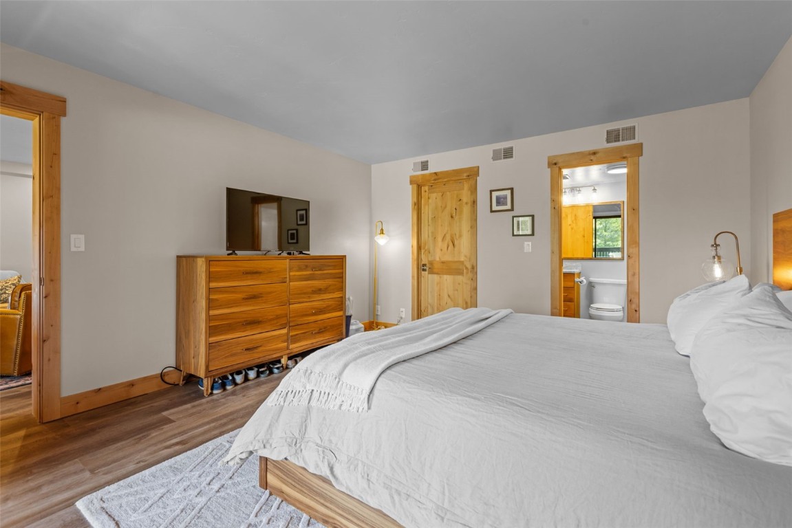 500 Bills Ranch Road, Unit 161 Frisco, CO 80443 - Photo 18 of 38 a bedroom with a bed and wooden floor