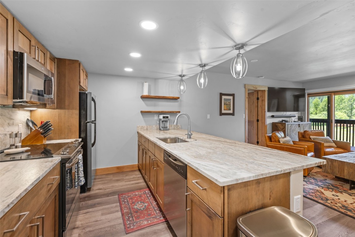 500 Bills Ranch Road, Unit 161 Frisco, CO 80443 - Photo 2 of 38 a kitchen with stainless steel appliances granite countertop a sink stove and refrigerator