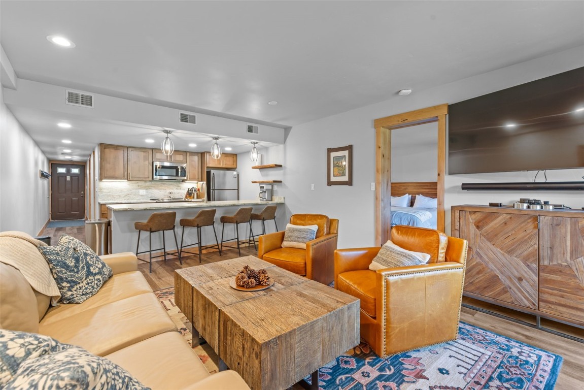 500 Bills Ranch Road, Unit 161 Frisco, CO 80443 - Photo 6 of 38 a living room with furniture and a flat screen tv