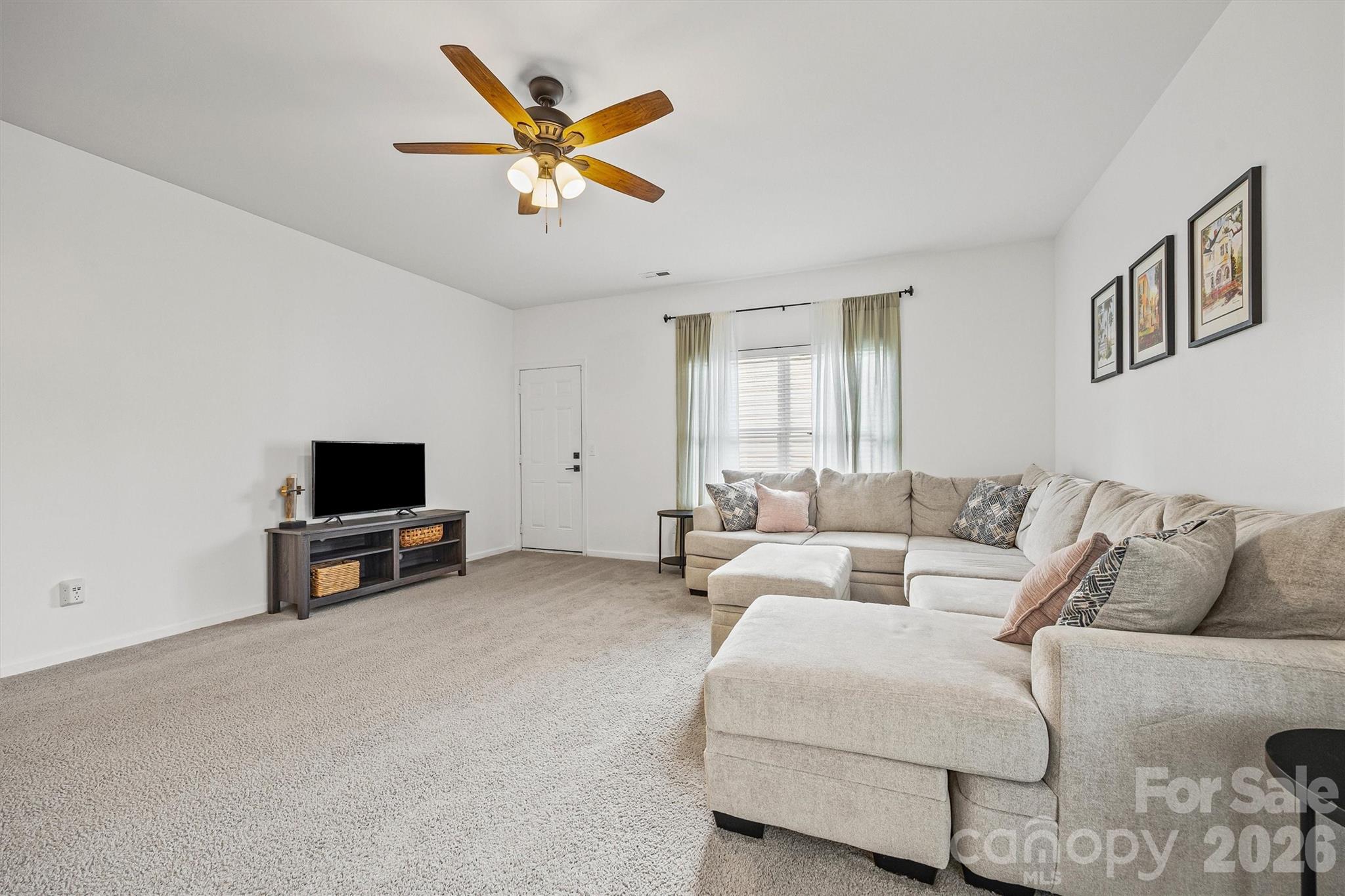 2133 Seabrook Lane Fort Mill, SC 29715 - Photo 12 of 28 a living room with furniture and a flat screen tv