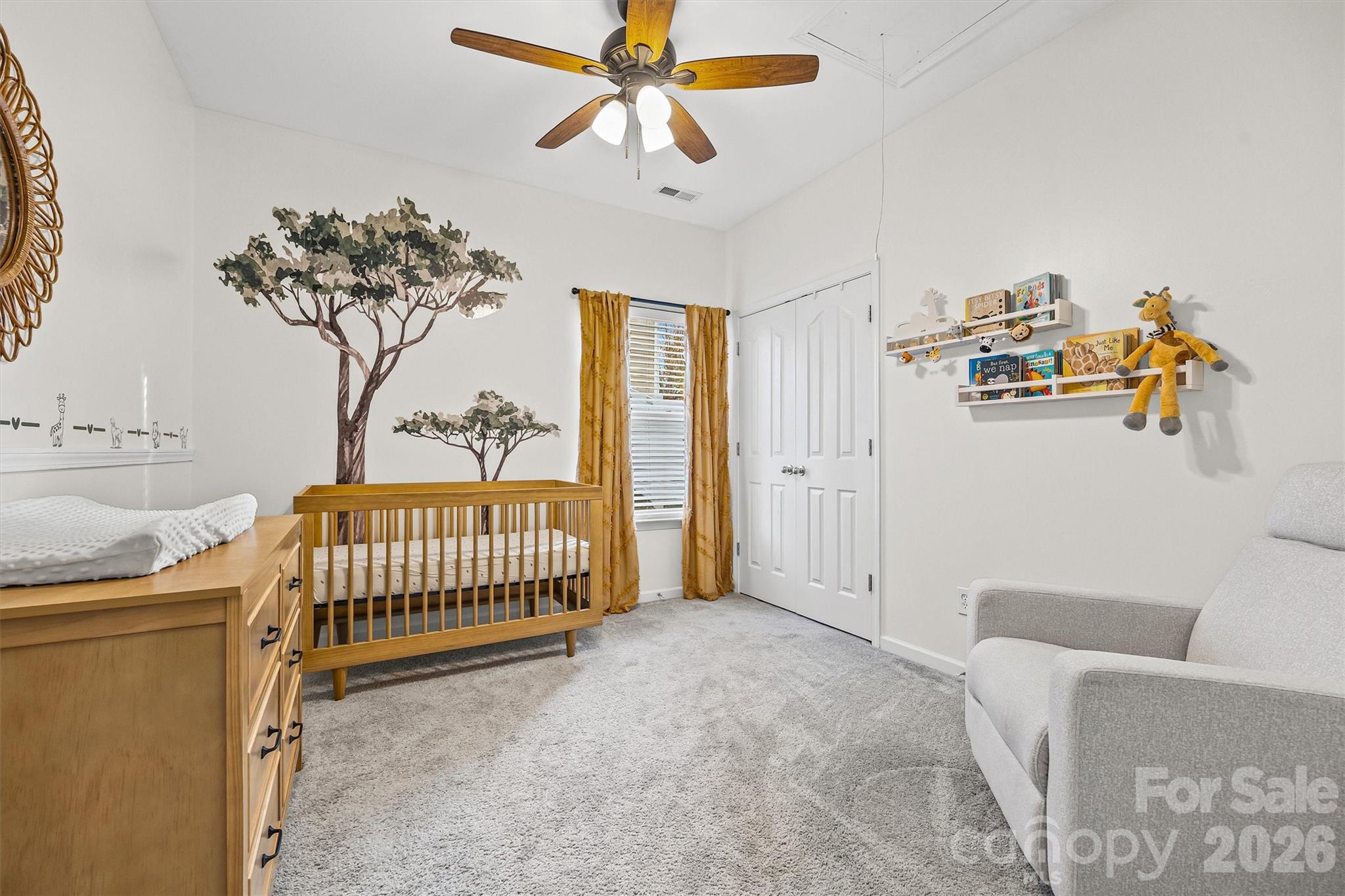 2133 Seabrook Lane Fort Mill, SC 29715 - Photo 18 of 28 a bedroom with a bed and a chandelier