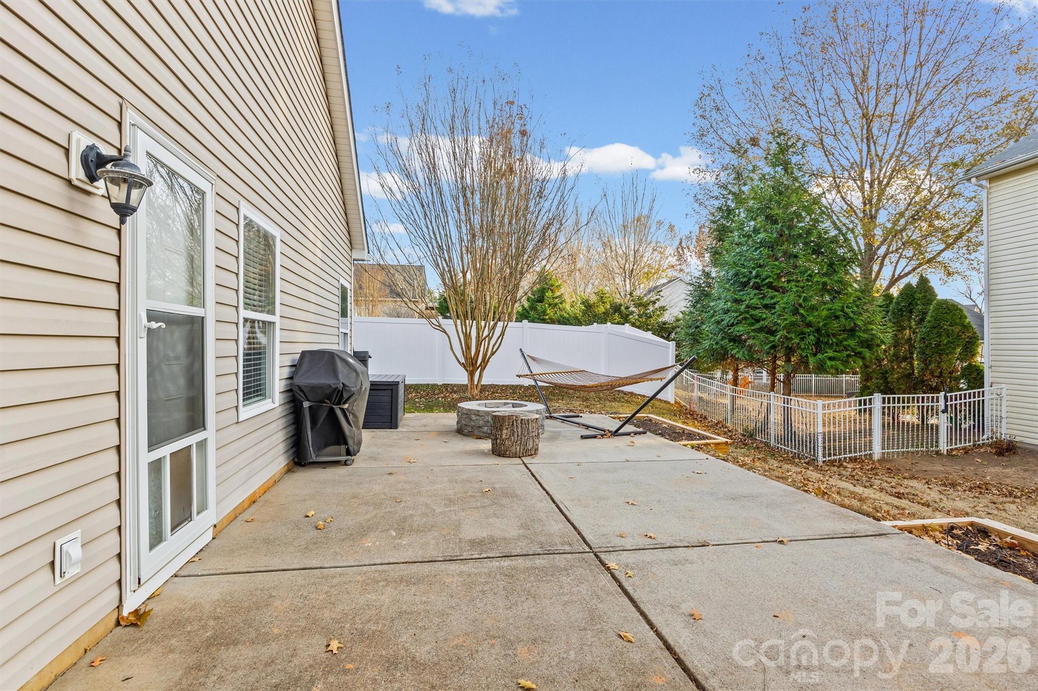 2133 Seabrook Lane Fort Mill, SC 29715 - Photo 24 of 28 a backyard of a house with table and chairs